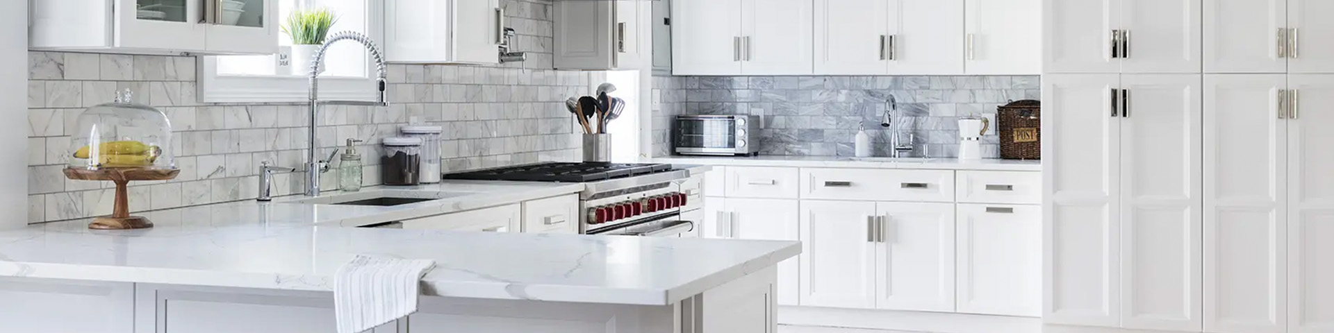 Quick Ship Bevel Onyx cabinets in White finish in a new kitchen